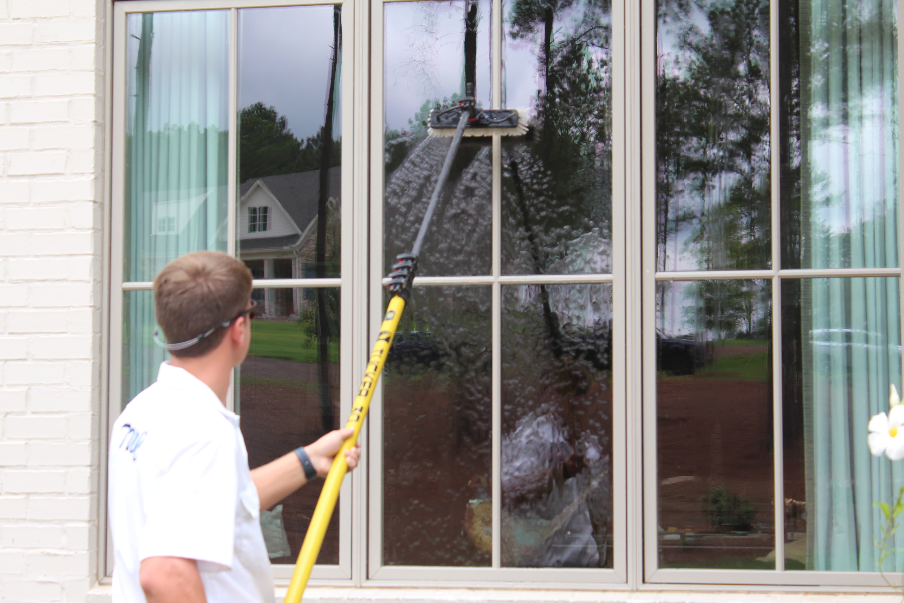 Commercial window squeegee in action