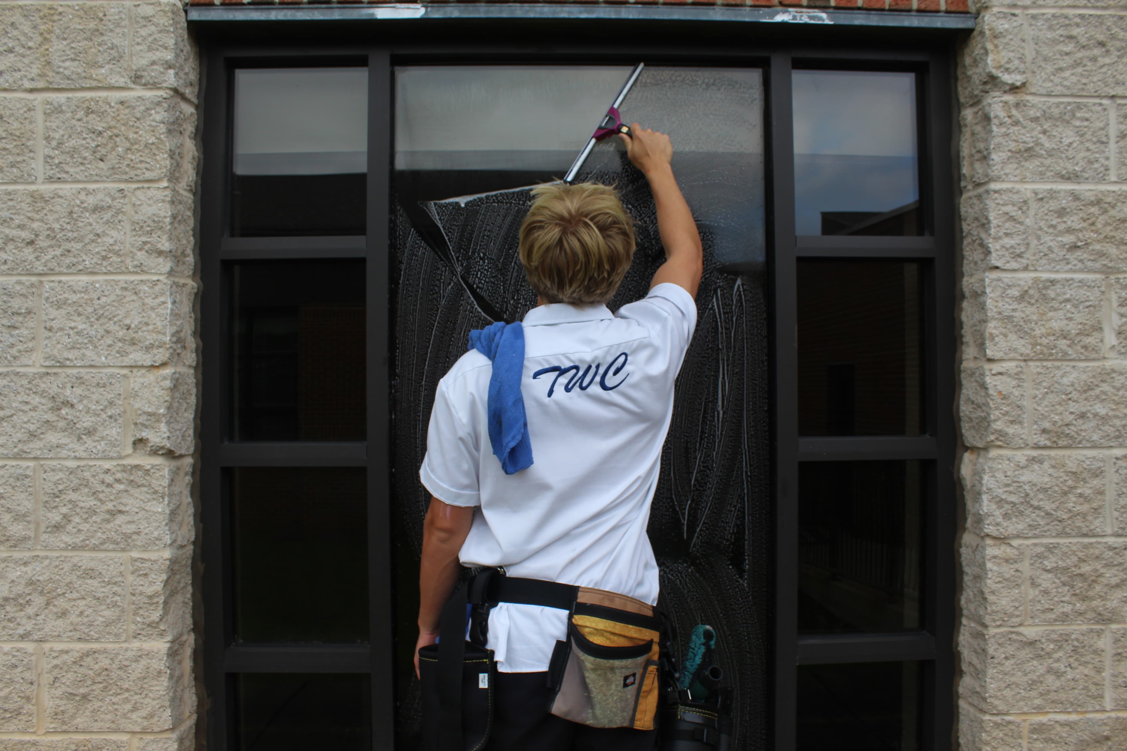 Residential window cleaned with squeegee for spotless finish